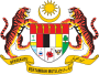 Shield showing the symbols of the Malaysian states with a star and crescent above and a motto below, supported by two tigers
