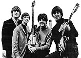 The Beatles (consisting of John Lennon, Paul McCartney, George Harrison, and Ringo Starr) released music throughout the 1960s, and are often considered the most popular band in global history. Beatlemania was/is the fanaticism surrounding The Beatles. The Beatles experienced intense fan worship during the '60s era.